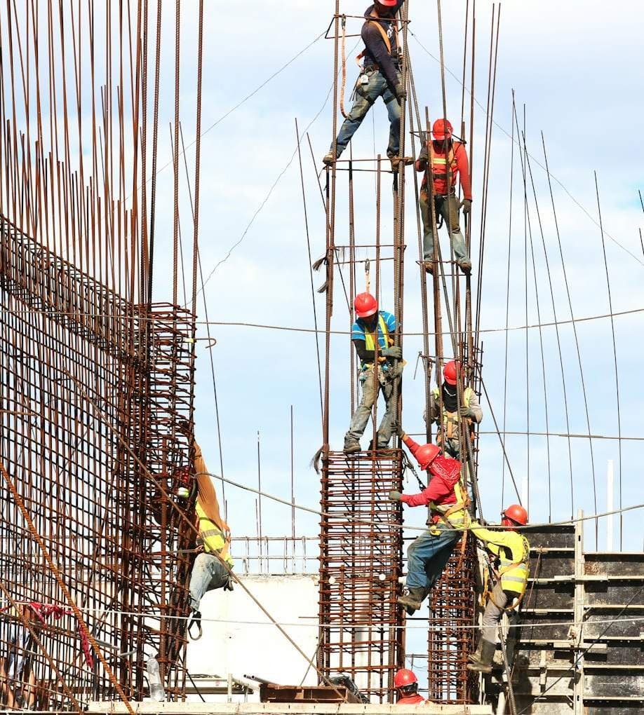Steel fixers on a reinforced concrete frame
